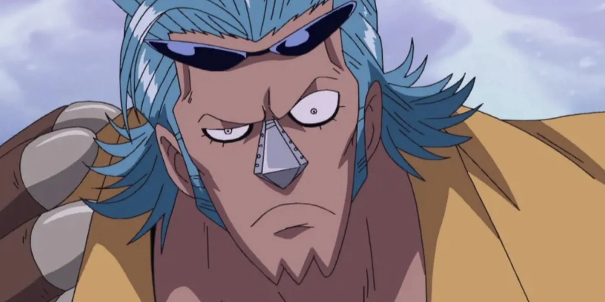 Franky, người máy trong One Piece, tạo dáng với cánh tay máy lớn và mái tóc xanh đặc trưng