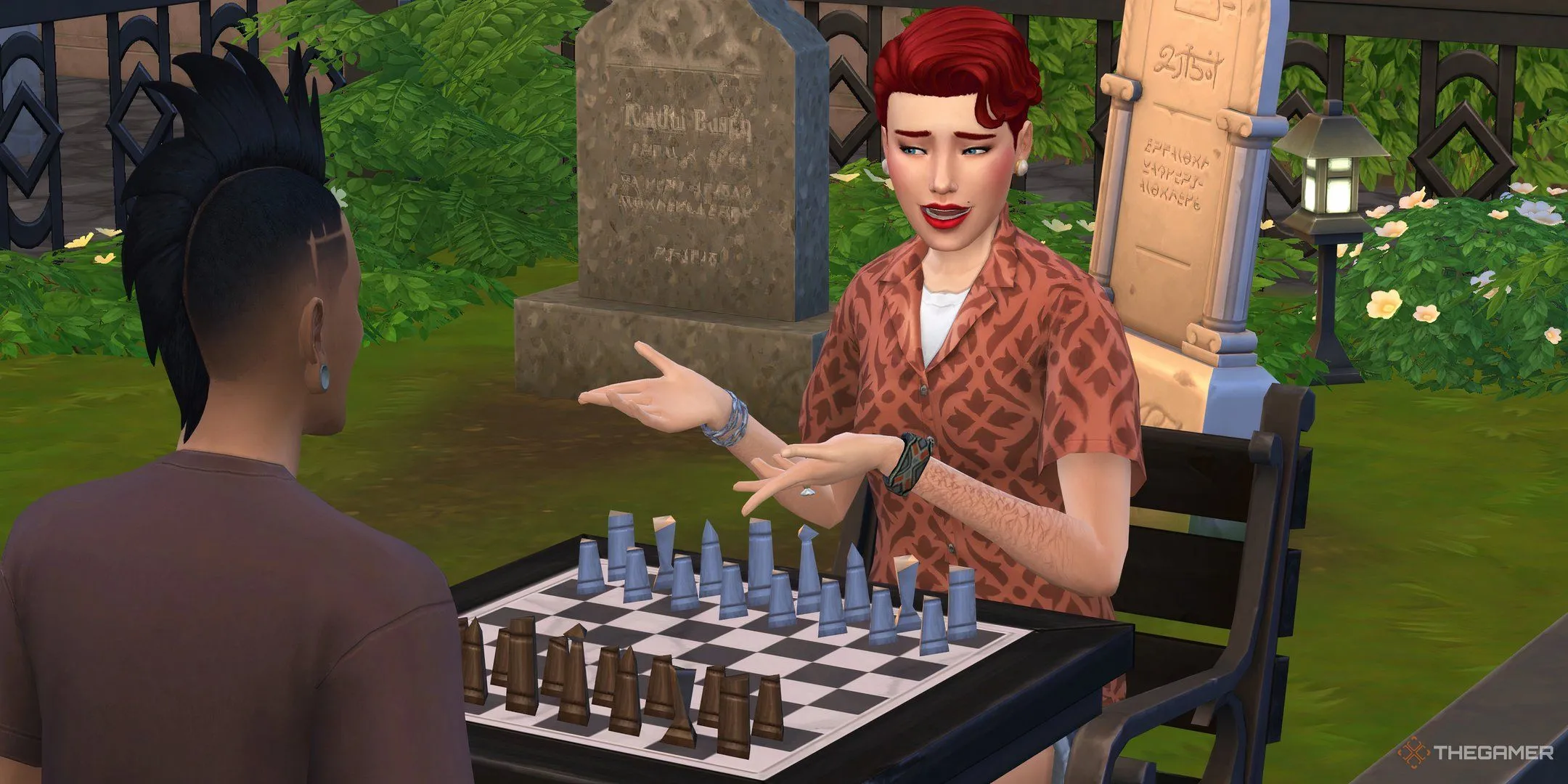Hai nhân vật Sims chơi cờ vua gần bia mộ trong tựa game The Sims 4