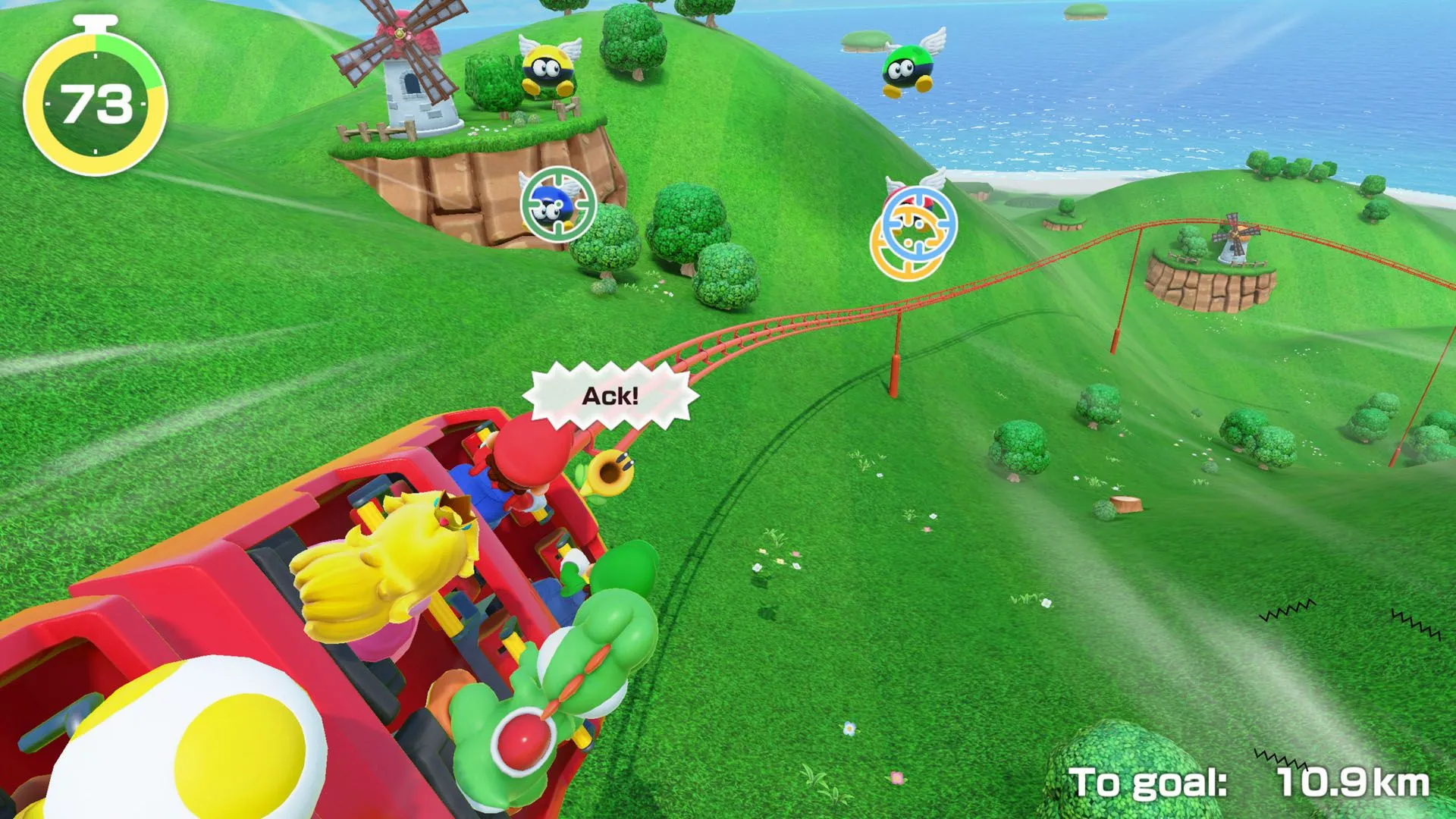 Người chơi đang trải nghiệm minigame Get a Grip, yêu cầu phối hợp motion control để leo tường trong Super Mario Party Jamboree.